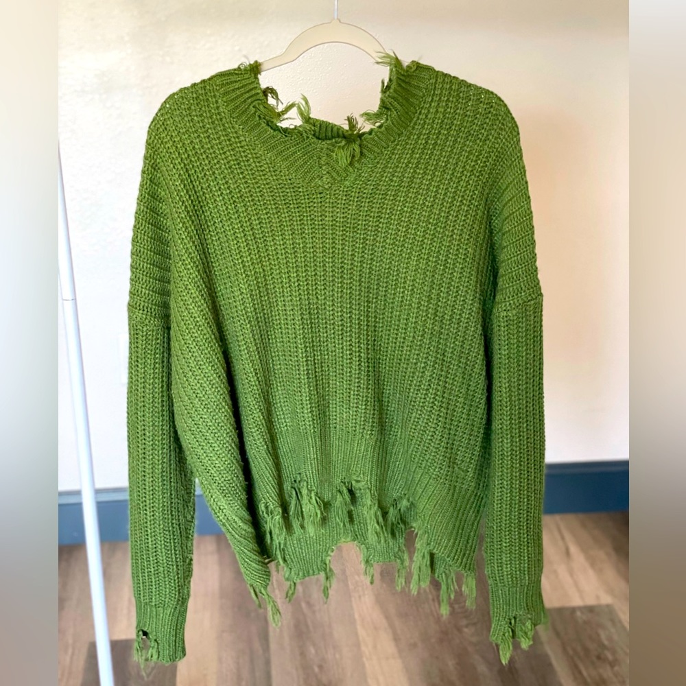 Green, distressed sweater